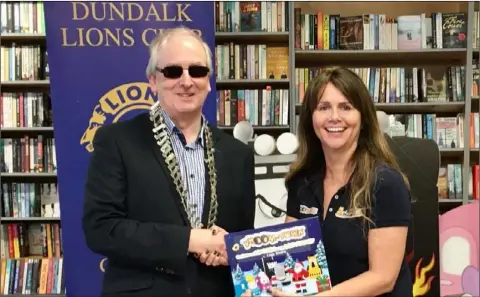  ??  ?? David Larkin, Dundalk Lions President and Emer Conlon, Author of Vroom-Town Christmas Book