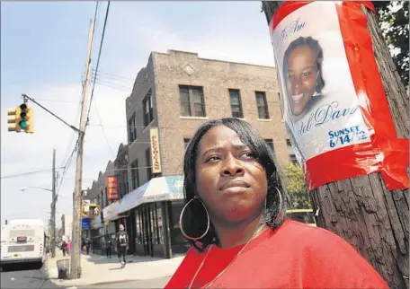  ?? Carolyn Cole Los Angeles Times ?? “THE POLICE portrayed her as a career criminal, but she was unarmed when they shot her.... That’s what I want people to remember,” says Natasha Duncan, standing on the Brooklyn corner where her sister Shantel Davis was killed by a police detective...