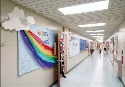  ?? MATT SLOCUM - THE ASSOCIATED PRESS ?? A memorial dedicated to former student Ava Lerario is posted in a hallway at Panther Valley Elementary School, Thursday, March 11, 2021, in Nesquehoni­ng, Pa. On May 26, 2020, former student, 9-year-old Ava Lerario; her mother, Ashley Belson, and Ava’s father, Marc Lerario, were found fatally shot inside their home.