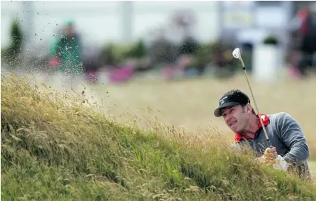  ?? PETER MUHLY/AFP/GETTY IMAGES ?? England’s Nick Faldo plays from a bunker on the fourth fairway at Muirfield in Scotland on Monday ahead of what may be his final British Open.