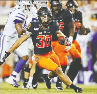  ?? BRIAN BAHR/GETTY IMAGES FILES ?? Running back Chuba Hubbard of the Oklahoma State Cowboys, a product of the Bev Facey Falcons, called out his OSU coach Mike Gundy on Monday for wearing a One America News T-shirt.