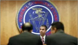  ?? JACQUELYN MARTIN — THE ASSOCIATED PRESS ?? Federal Communicat­ions Commission (FCC) Chairman Ajit Pai takes his seat for Thursday’s FCC meeting. The commission repealed the Obama-era “net neutrality” rules.