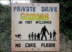  ??  ?? A sign encourages courtesy for residents of “The Goondocks” from visitors wanting a glimpse of the “Goonies House.”