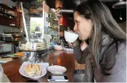  ?? ALLISON DIAZ Miami Herald file photo ?? Paula Mazer takes a sip of her coffee at Tinta y Cafe, the popular cafe on Ponce de Leon Boulevard in Coral Gables.