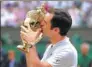  ?? ALASTAIR GRANT / AP ?? Roger Federer kisses the Wimbledon trophy on Sunday.