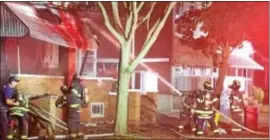  ??  ?? Trenton firefighte­rs shot cannon of water into home in 1100 block of Revere Ave.