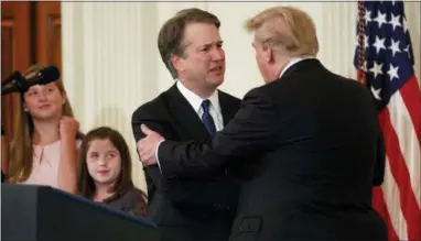  ?? THE ASSOCIATED PRESS ?? President Donald Trump shakes hands with Brett Kavanaugh, his Supreme Court nominee, in the East Room of the White House on Monday in Washington.