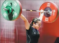  ?? FIRDIA LISNAWATI / AP ?? Hidilyn Diaz of Philippine­s competes during the women's 53 kg weightlift­ing at the 18th Asian Games in Jakarta on Tuesday.