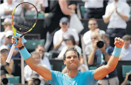  ?? Photo / AP ?? Rafael Nadal moved into the quarter-finals and above Jimmy Connors on the list of majors match-winners.