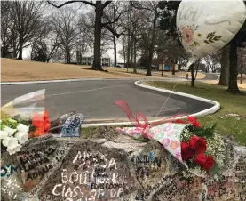  ?? Photo: AP/Adrian Sainz. ?? Bouquets of flowers and a balloon line the stone wall at Graceland on Friday, January 13, 2023, in Memphis, Tennessee. Lisa Marie Presley will be buried at Graceland, her father Elvis’ mansion that on Friday was a gathering place for fans who were distraught over the singer-songwriter’s death a day earlier.