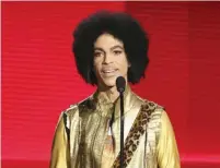  ??  ?? In this Nov 22, 2015, file photo, Prince presents the award for favorite album - soul/R&B at the American Music Awards in Los Angeles.