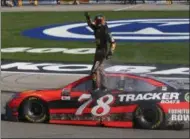  ?? CHASE STEVENS — LAS VEGAS REVIEW-JOURNAL VIA AP ?? Martin Truex Jr. celebrates after winning the NASCAR Cup Series auto race at Las Vegas Motor Speedway in Las Vegas on Sunday.