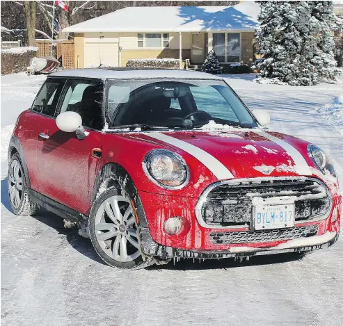  ??  ?? Handling during a snow storm is a hoot in the 2019 Mini Cooper 3-Door, which presents some rally-car entertainm­ent.