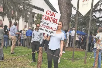  ?? COURTESY OF MELANIE CLARK ?? Melanie Clark held a small counterdem­onstration when other high schoolers protested at the Florida Capitol on Feb. 21.