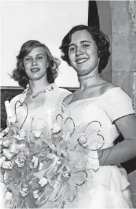  ?? THE COMMERCIAL APPEAL FILES ?? Miss Anne Elizabeth Mitchell, left, had the highest four-year and senior year averages at Miss Hutchison’s School when she was graduated in May 1953. Miss Elizabeth Carleton Etter ranked second in the class which received diplomas at Idlewild...