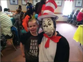  ?? GLENN GRIFFITH — MEDIANEWS GROUP ?? Hunter McKenna, 5, poses with the Cat in the Hat at the Dr. Seuss Breakfast on Saturday at the Cohoes-Waterford Elks lodge in Cohoes.