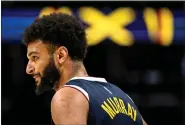  ?? AARON ONTIVEROZ, THE DENVER POST ?? Jamal Murray (27) of the Denver Nuggets works en route to scoring 22points against the Houston Rockets in the first half during the second quarter at Ball Arena in Denver on Monday, Nov. 28, 2022.