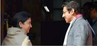  ?? — PTI, PRITAM BANDYOPADH­YAY ?? Union ministers Smriti Irani with MoS Rajyavardh­an Singh Rathore ( clockwise from above), Congress leader Ghulam Nabi Azad and a group of women workers from TRS at Parliament House in New Delhi on Wednesday.