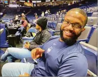  ?? David Borges / Hearst Connecticu­t Media ?? Former Ohio State running back Maurice Clarett sits behind the UConn men’s basketball team’s bench during Saturday’s game at Xavier.