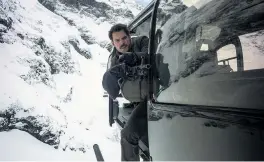  ?? PHOTOS: PARAMOUNT PICTURES ?? Action man . . . Henry Cavill in action during a helicopter chase sequence filmed in Queenstown last year as part of Mission: Impossible — Fallout. Right: Tom Cruise in action during a stunt sequence.