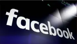  ?? Richard Drew/AP ?? Facebook has reportedly been paying users, some as young as 13 years old, up to $20 a month to install data-mining applicatio­ns.