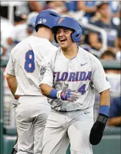  ?? NATI HARNIK / ASSOCIATED PRESS ?? Florida’s Mike Rivera reacts after he scored on Christian Hicks’ double in the fifth inning. Hicks tripled and scored in the seventh.