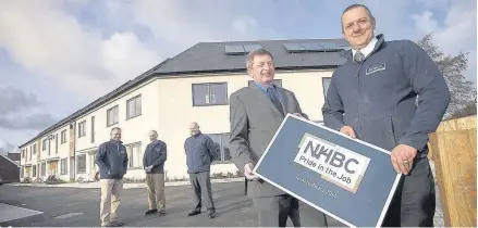  ??  ?? Anwyl Building award in Amwlch. Pictured NHBC Area Inspection Officer John Hayward with Site Manager Roy Hammans and (from left,) John Wilson and John Ellis, of Anwyl Constructi­on and Barry Evans, of Clwyd Alyn Housing