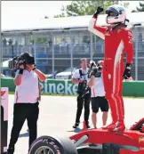  ??  ?? ON TOP: Sebastian Vettel celebrates pole