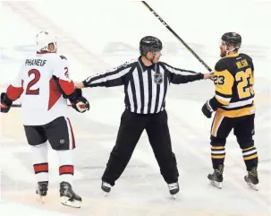  ?? CHARLES LECLAIRE, USA TODAY SPORTS ?? Scott Wilson, in a squabble with the Senators’ Dion Phaneuf, was among seven goal scorers for the Penguins in Sunday’s victory. It was Wilson’s second career postseason goal.