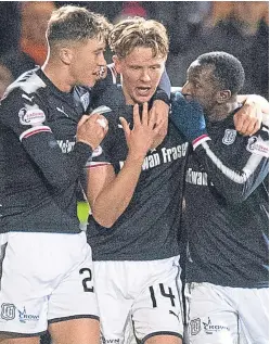  ??  ?? Joy for Dundee stars Jack Hendry, Mark O’Hara and Glen Kamara after last Friday’s victory over Rangers.
