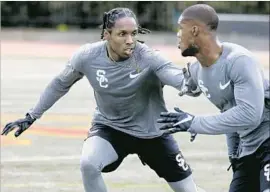  ?? Luis Sinco Los Angeles Times ?? ADOREE’ JACKSON, left, works on his coverage skills during USC’s pro day. Jackson gave up his senior season with the Trojans to enter the NFL draft.