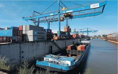  ?? /Picture: Krisztian Bocsi/Bloomberg ?? Mega Moolah: A ship-to-shore crane loads shipping containers on to a barge at Duisport shipping port in Duisburg, Germany, on Tuesday, Sept. 11, 2018. The trade route known in Beijing as the Belt and Road Initiative is spurring $1trillion of investment.