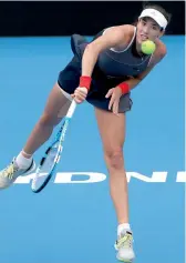  ?? AP ?? Garbine Muguruza serves to Kiki Bertens in their women’s singles match at the Sydney Internatio­nal tennis tournament on Wednesday. Muguruza won 6- 3, 7- 6 ( 6). —