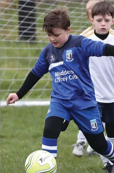  ??  ?? Finn Mooney on the ball for Boyne Rovers during their Under-8 game against Drogheda Boys on Saturday.