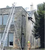  ??  ?? Firefighte­rs tackle the massive fire that has gutted Silverburn House.