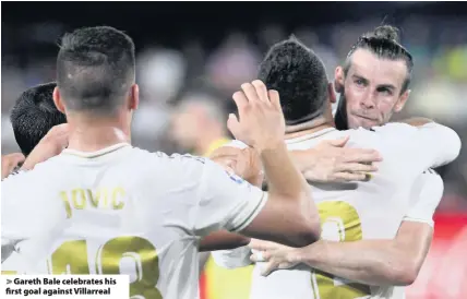  ??  ?? > Gareth Bale celebrates his first goal against Villarreal