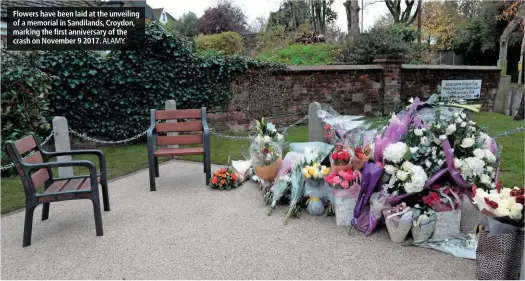  ?? ALAMY. ?? Flowers have been laid at the unveiling of a memorial in Sandilands, Croydon, marking the first anniversar­y of the crash on November 9 2017.