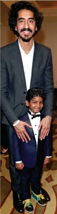  ??  ?? Co-stars: Patel with Lion’s Sunny Pawar, 8