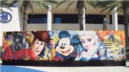  ?? Alex Saker / Contribute­d photo ?? ARCY's mural at the Disney D23 Expo in Anaheim, Calif., in 2019.