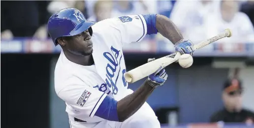  ?? Charlie Riedel / The Associat ed Press ?? Slick-fielding outfielder Lorenzo Cain is a contributo­r to the Royals speed-oriented approach to the game.