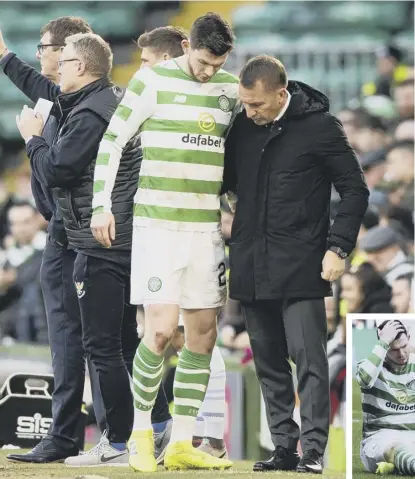  ??  ?? 2 Brendan Rodgers helps Oliver Burke on the sidelines after the forward was forced to limp out of Celtic’s match against St Johnstone yesterday after suffering an ankle injury.