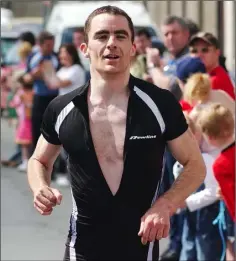  ??  ?? A very relaxed looking Thomas Elliott comes home in first place in the Blackrock Crosscause Triathlon.