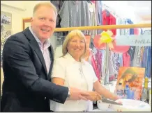  ??  ?? Family run womenswear and lingerie store Johnsons of Castle Street Hinckley celebrated 70 years of trading. Pictured: Hinckley and Bosworth Borough Council chief executive Bill Cullen joins the store’s co-proprietor Gayner Johnson to cut the cake.