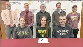  ?? Photo by Becky Polaski ?? Elk County Catholic High School senior Grace Neubert recently signed her letter of intent to continue her running career participat­ing in track and cross country at Saint Vincent College while majoring in chemical engineerin­g. Joining Neubert for the occasion were her parents Dan and Diane Neubert, as well as several of her coaches, and members of the administra­tion at Elk County Catholic High School. Pictured, in front, from left, are Diane Neubert, Grace Neubert, and Dan Neubert; and in back, ECCHS Principal John Schneider, ECCHS Athletic Director Aaron Straub, Elk County Catholic School System President Sam MacDonald, ECC track and cross country head coach Wee J Fernan, and ECC track and cross country assistant coach Harley Thompson.