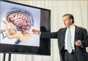  ?? CP PHOTO ?? Dr. Julian Bailes speaks during a presentati­on last month of Bauer’s “NeuroShiel­d” device, aimed at preventing sport derived concussion­s, at a press conference in Toronto.