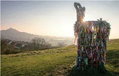  ?? MATT CARDY/GETTY ?? The sun rises behind the Holy Thorn on Wearyall Hill