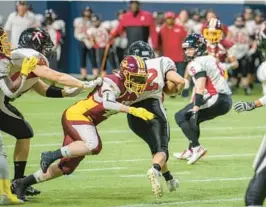  ?? CHRIS BROOKS OF B-LINE PRODUCTION­S ?? Chantal Ridlon Thacker makes a tackle as a member of the DC Divas of the Women’s Football Alliance. She feels playing the sport leaves an impact on the players she coaches.