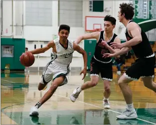  ?? PHOTO BY PIETRO BREZZO ?? Homestead’s Daniel Brathwaite (31) drives past two defenders in his team’s home game against Los Gatos on Feb. 5. Brathwaite scored 10points in Homestead’s 51-41victory.