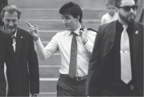  ?? JUSTIN TANG/THE CANADIAN PRESS ?? Prime Minister Justin Trudeau heads to an end-of-session news conference in Ottawa on Wednesday.