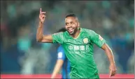  ?? XIN LI / GETTY IMAGES ?? Cedric Bakambu celebrates scoring his first goal for Beijing Guo’an in Sunday’s Chinese Super League match at Jiangsu Suning in Nanjing.